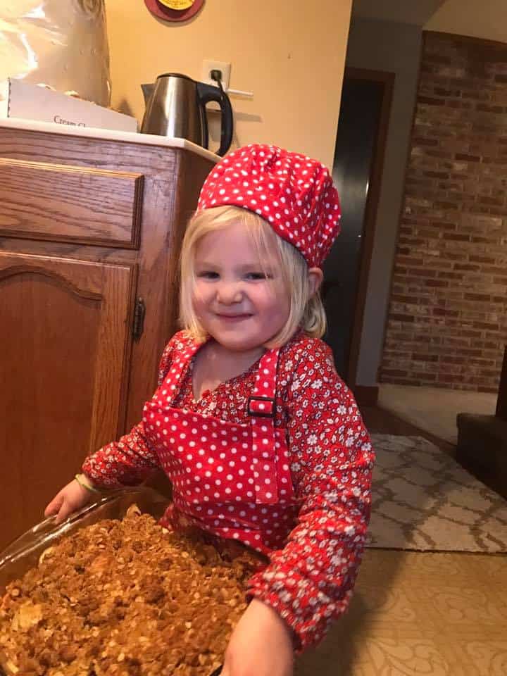 little girl baking muffins independently with Kids Cook Real Food