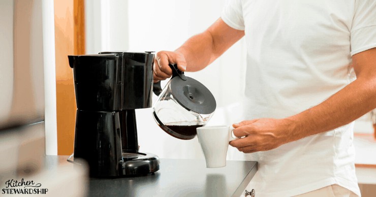 man pouring coffee into a mug