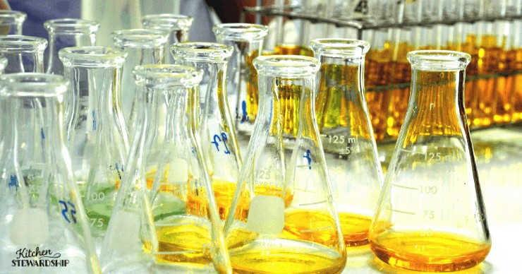 chemistry flasks measuring golden liquid