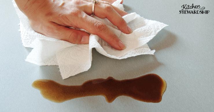 Paper towel cleaning up spilled coffee