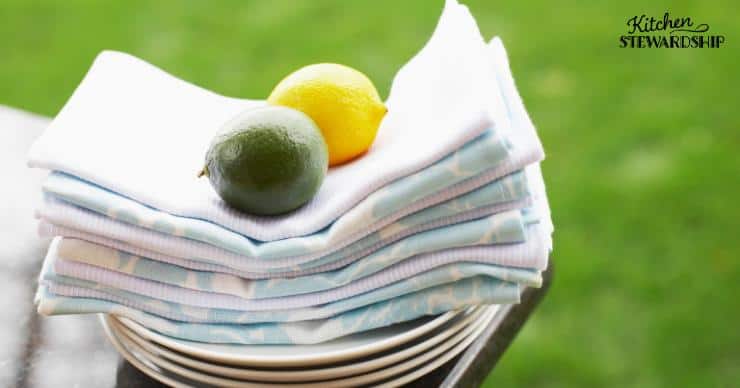 Stock of reusable cloth napkins with a lime and lemon on top