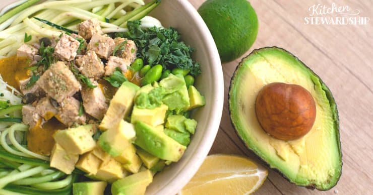 A nutrient dense meal or snack of zoodles, avocado, tuna, and other vegetables.