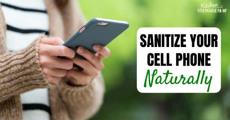 A woman holding her cell phone - Sanitize your cell phone naturally