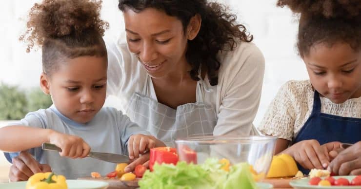 woman with kids cooking