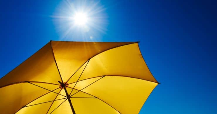 sunshine on yellow umbrella