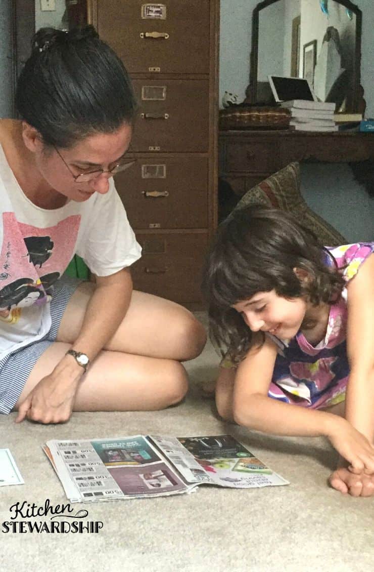 mom and daughter looking at marketing ads