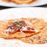 Keto tortillas on a plate with pepperoni and cheese made with the grain free keto tortillas recipe