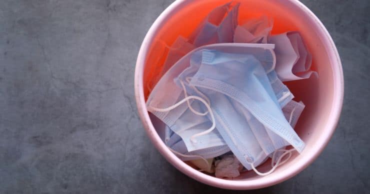 Face masks in the trash