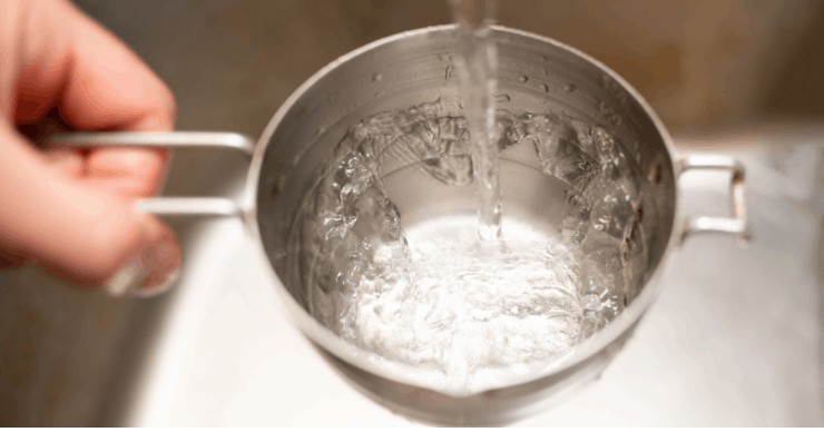 Water filling a measuring cup