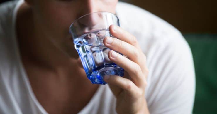 man drinking water