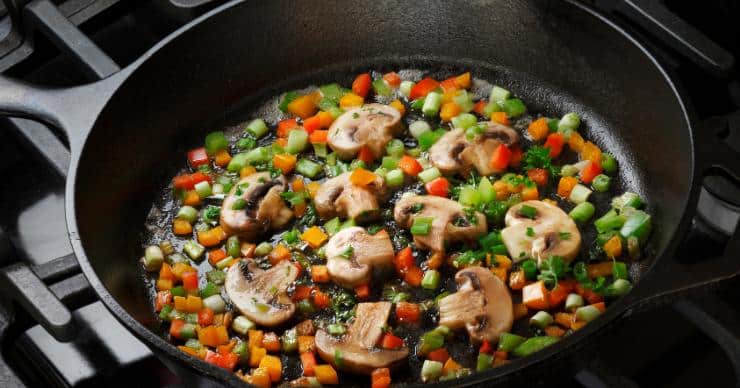Vegetables sauteed in a cast iron pan