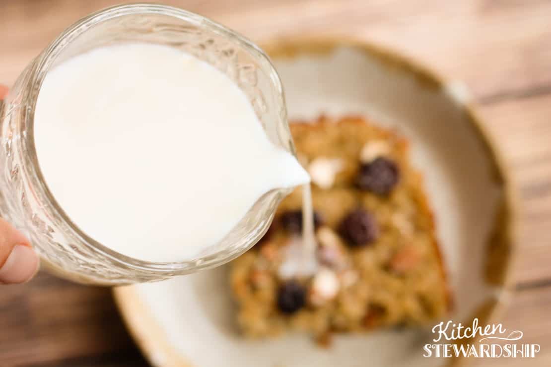 milk being poured over baked oatmeal