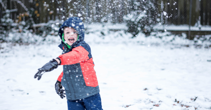 kid throwing snow