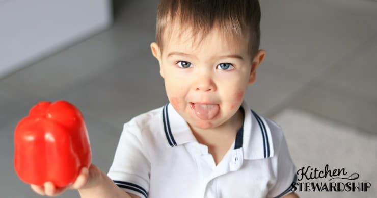 boy holding a pepper