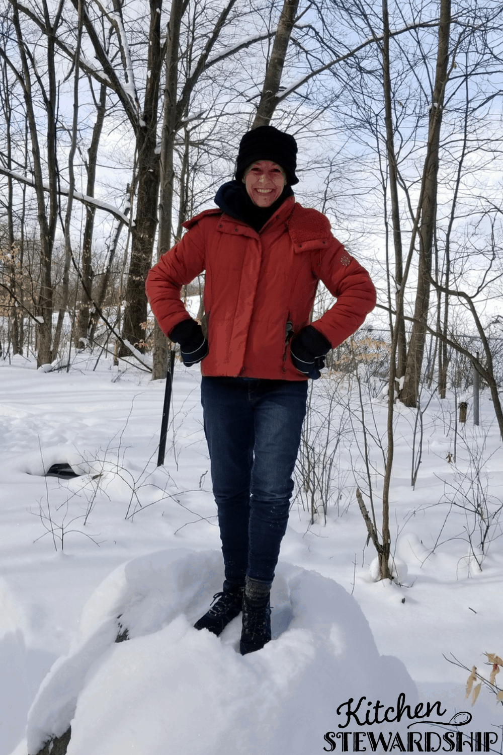 Katie standing on a snow pile
