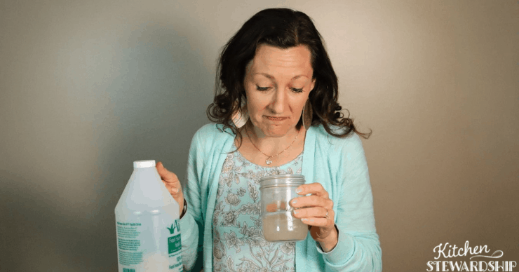 Katie looking at cup of stockton aloe