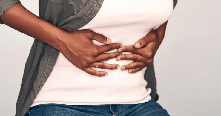 woman holding stomach