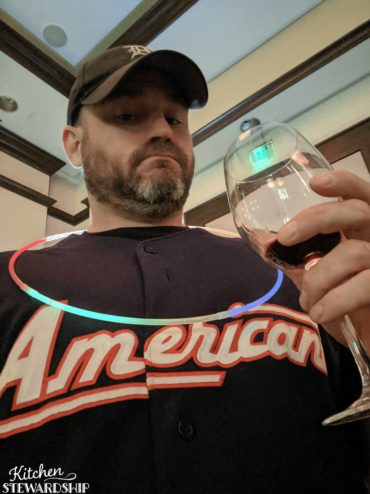 Kris drinking a glass of wine