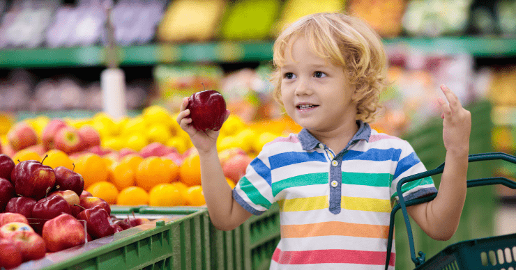 boy holding apple