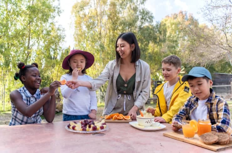 kids eating at picnic table