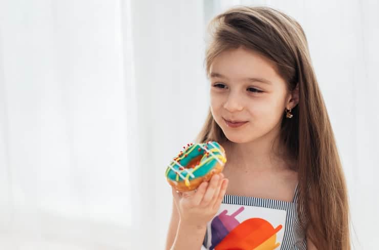 girl eating doughnut