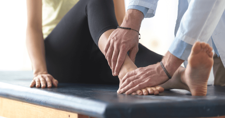 doctor examining ankle