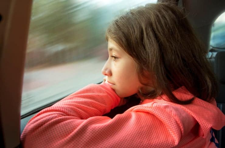 girl looking out window