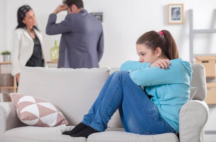 Girl listening to parents fighting