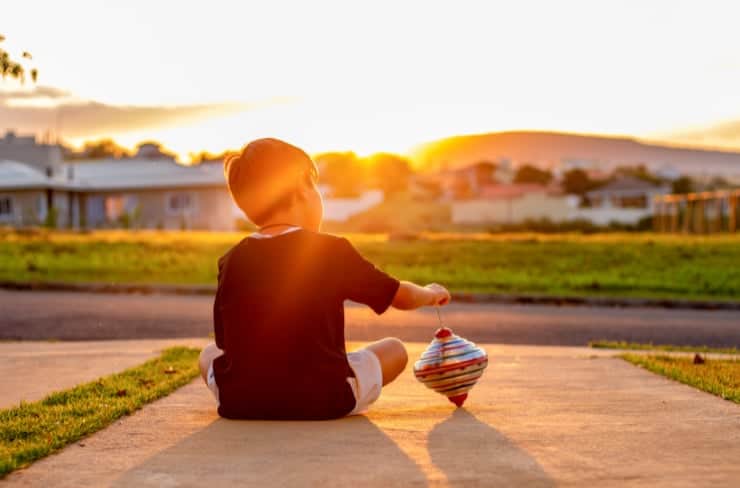 kid playing with a top
