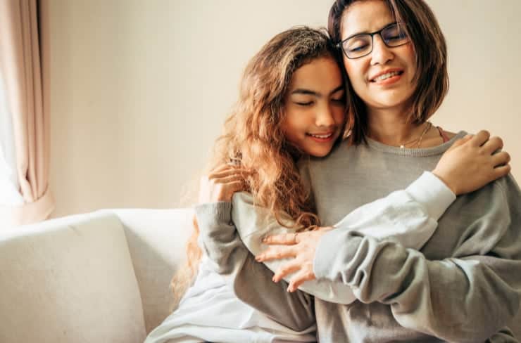 daughter and mother hugging