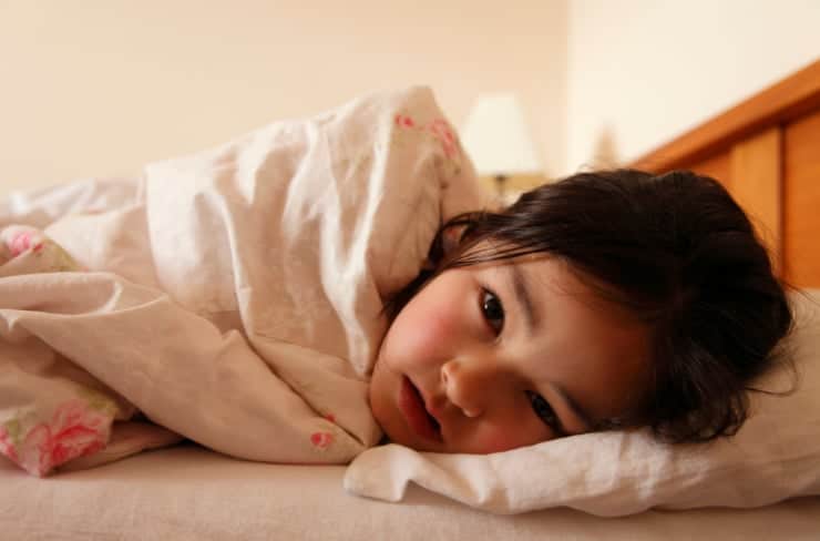 girl wrapped in blanket