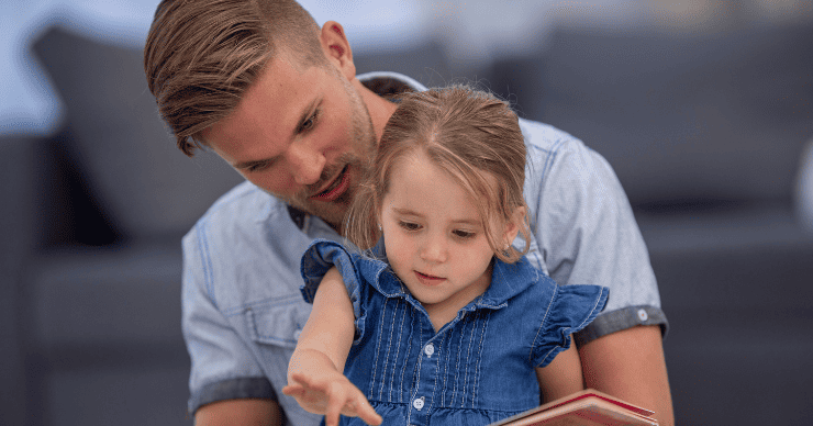 dad reading to daughter