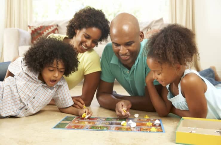 family playing board game
