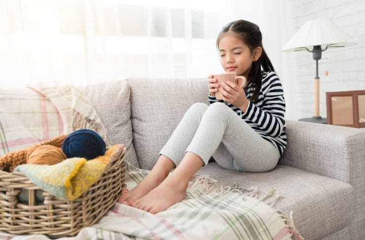 girl on couch with tea