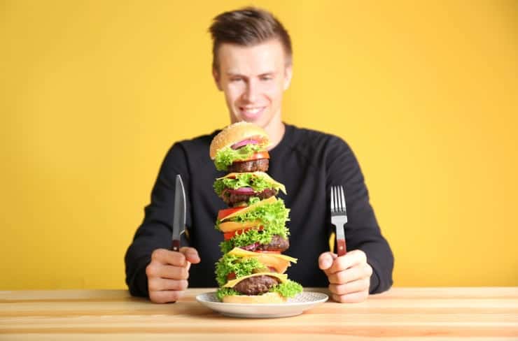 man eating a burger
