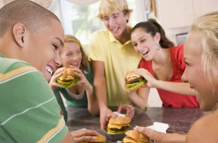 teens eating burgers