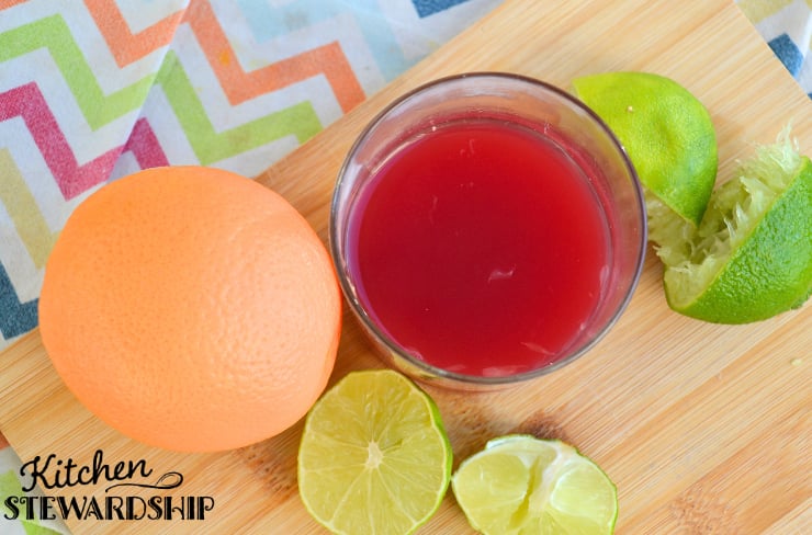 electrolyte mocktail with orange, lime and cranberry