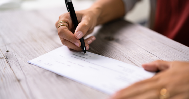 woman writing check
