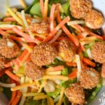 air fryer mozzarella balls on a salad