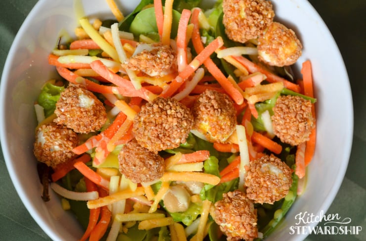 air fryer mozzarella balls on a salad