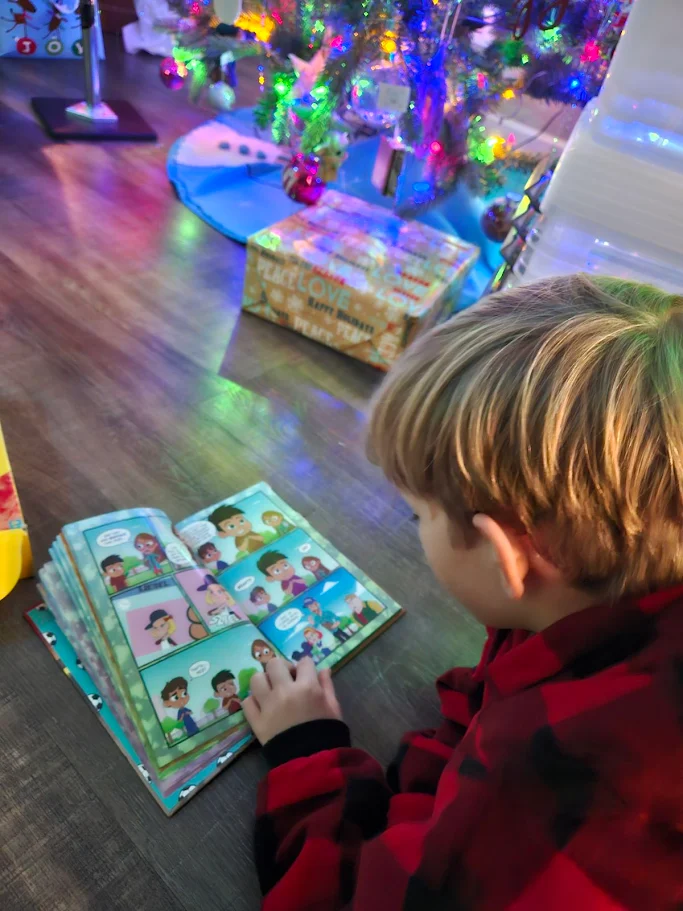 Gabe reading Tuttle Twins graphic novel