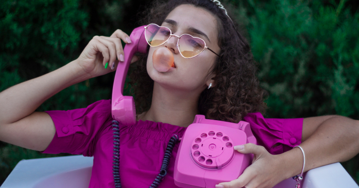 girl using rotary phone